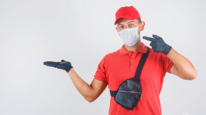 Technician holding an NEA pest control licence card for verification in Singapore