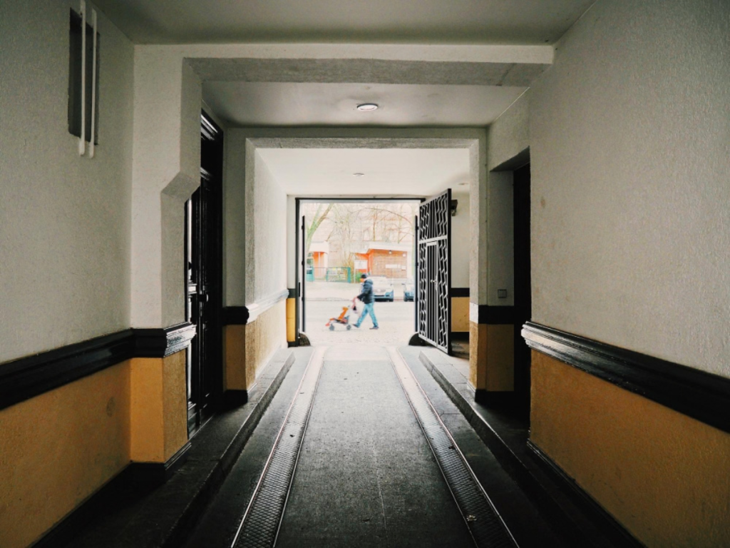 Split view of an HDB flat corridor and a condominium common area in Singapore